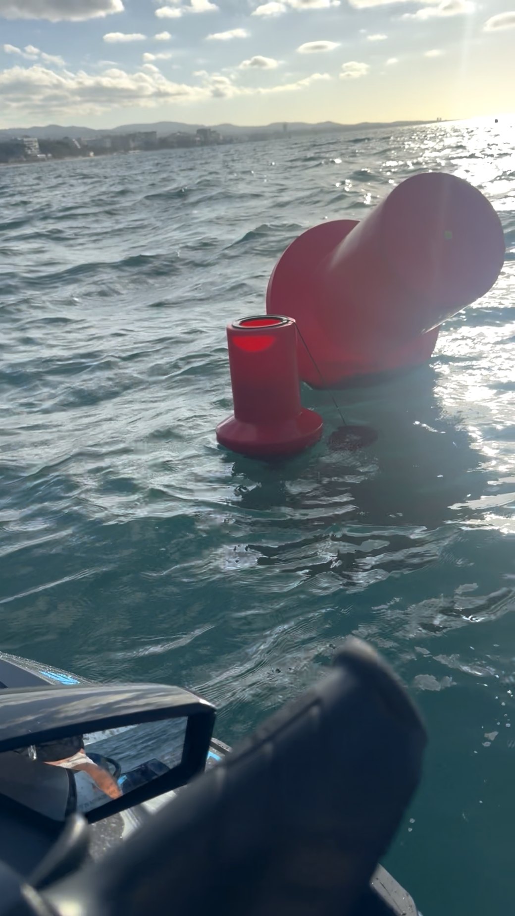 The buoy heeled right over in the water, its top low